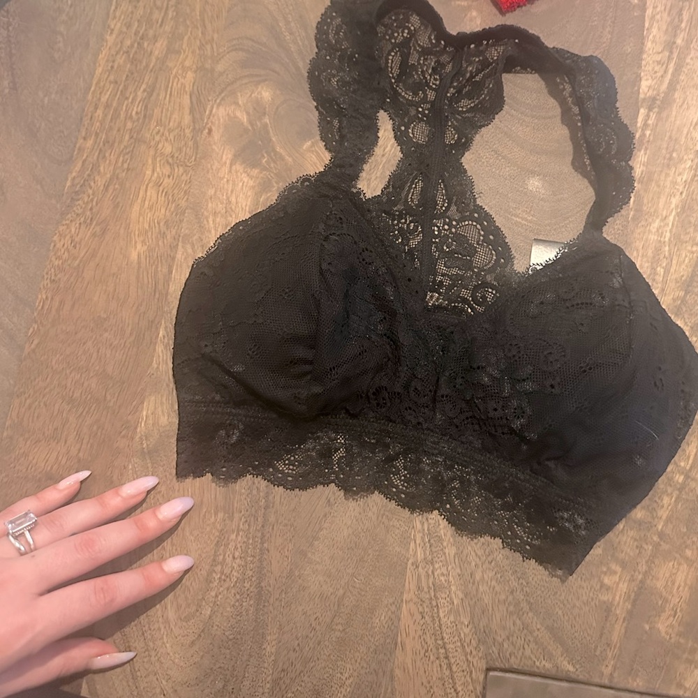 Lace bralette built, can be worn as a top or under. Super feminine & sexy.
